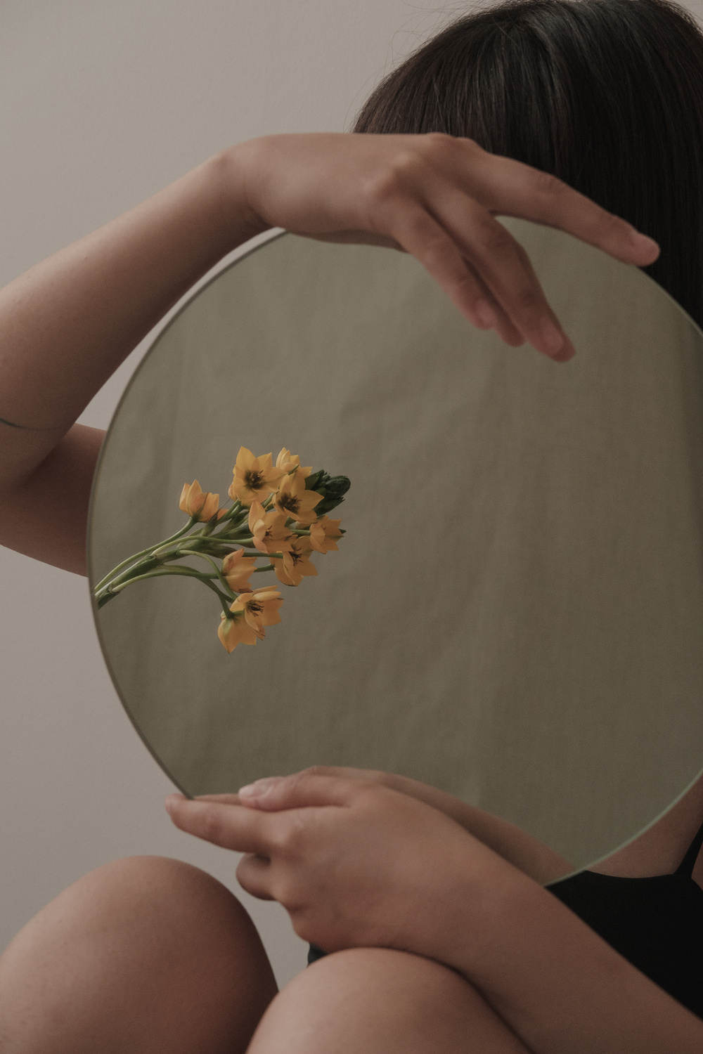 Woman Holding Round Mirror